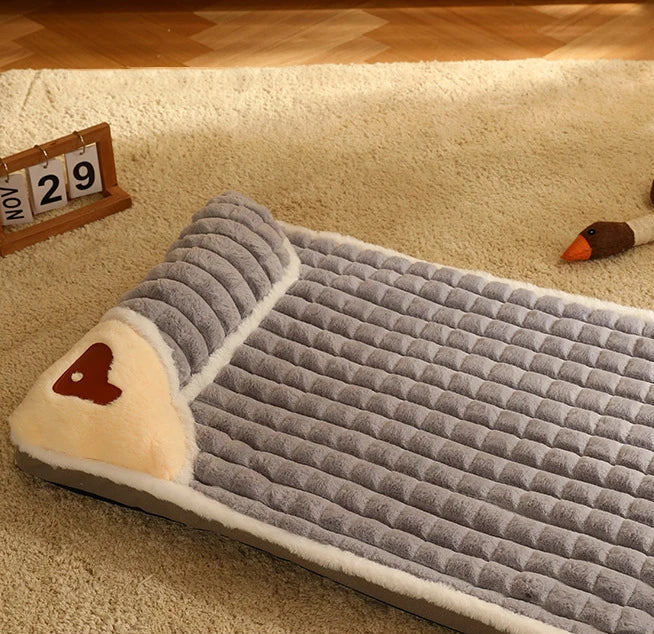 Lit traversin moelleux avec housse lessivable